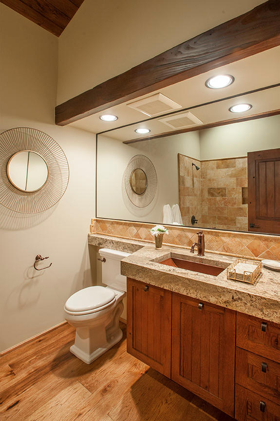 20 Alisal Road Santa Barbara, CA 93103 - Photo 21 of 32 a bathroom with a granite countertop toilet a sink and a mirror