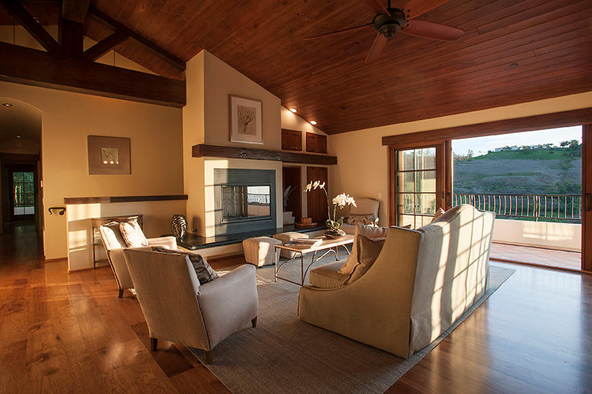 20 Alisal Road Santa Barbara, CA 93103 - Photo 9 of 32 a living room with fireplace furniture and a wooden floor