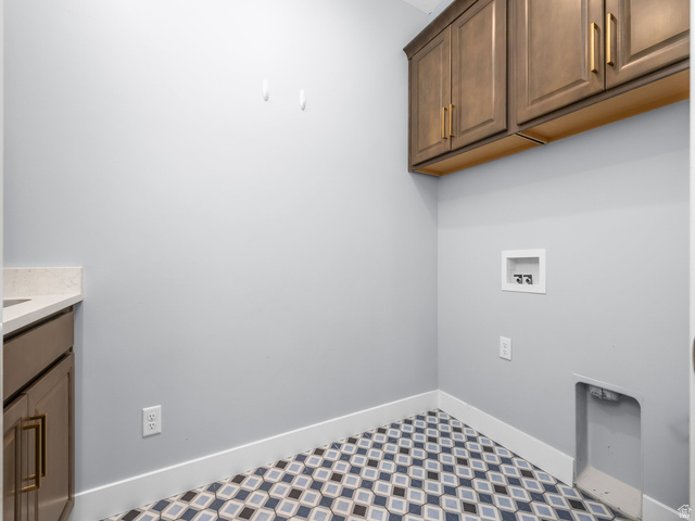 877 South Yarrow Drive Mapleton, UT 84664 - Photo 27 of 46 Laundry area featuring patterned tile flooring and light gray walls