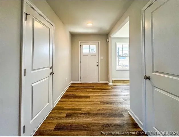 a view of bathroom with wooden floor