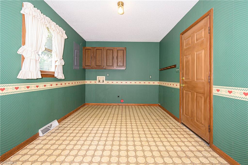 4340 Stone Ridge Drive Trinity, NC 27370 - Photo 15 of 29 Large mud room/laundry room with a door to the patio.