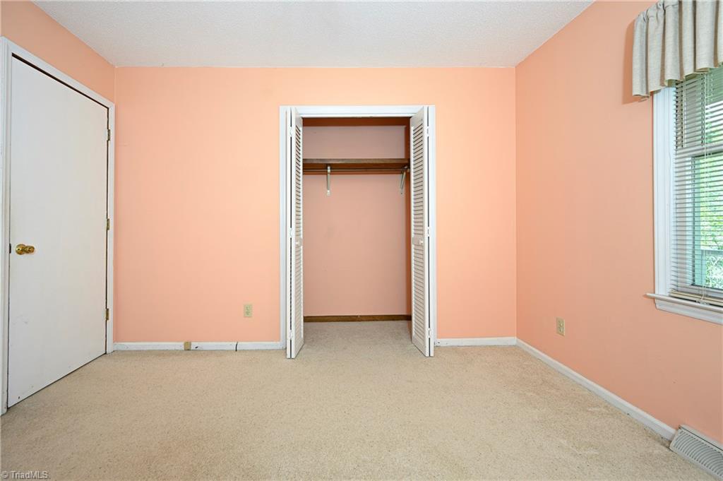 4340 Stone Ridge Drive Trinity, NC 27370 - Photo 20 of 29 2nd bedroom showing closet. Closet goes back further than what is visible.