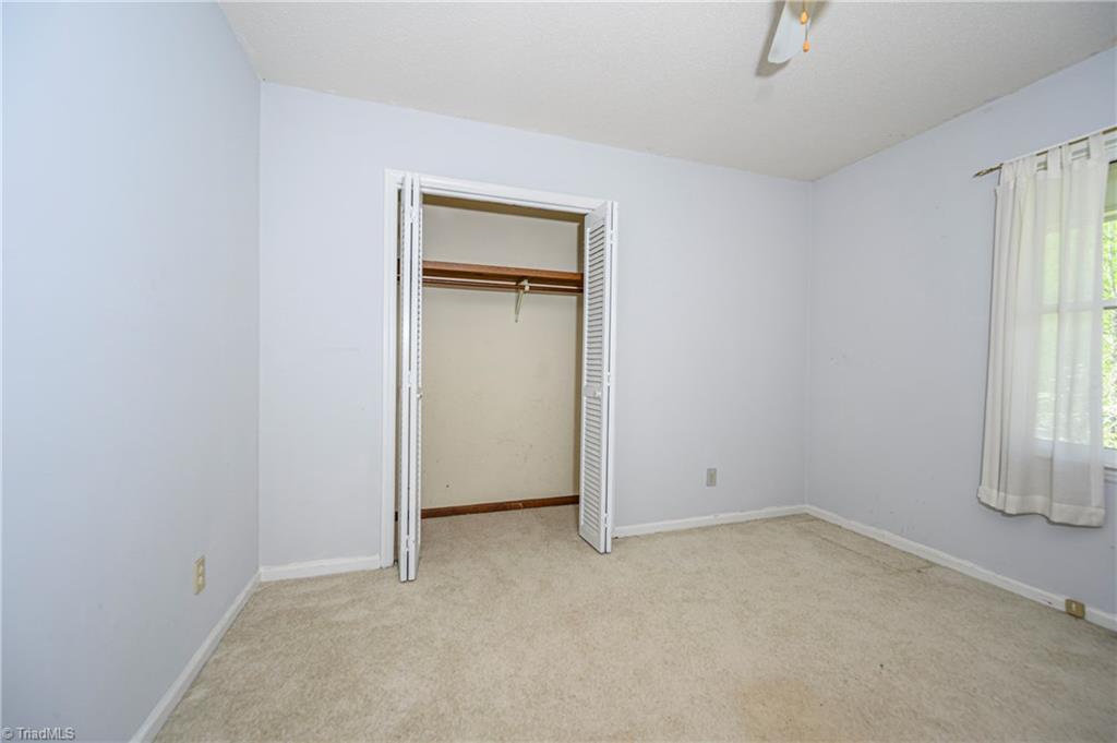 4340 Stone Ridge Drive Trinity, NC 27370 - Photo 22 of 29 3rd bedroom with closet showing. Closet goes further than what is visible.