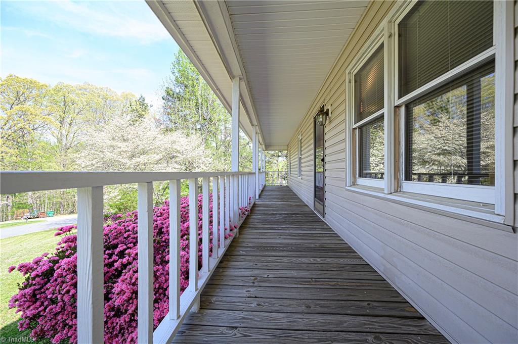 4340 Stone Ridge Drive Trinity, NC 27370 - Photo 6 of 29 Perfect porch for a front porch swing and rocking chairs!