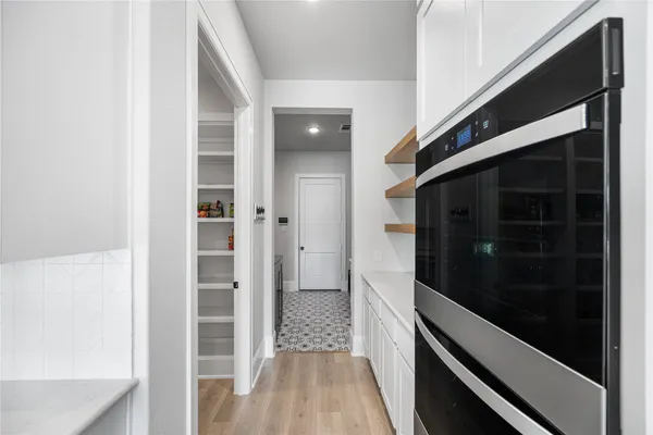 a kitchen with a refrigerator and a sink