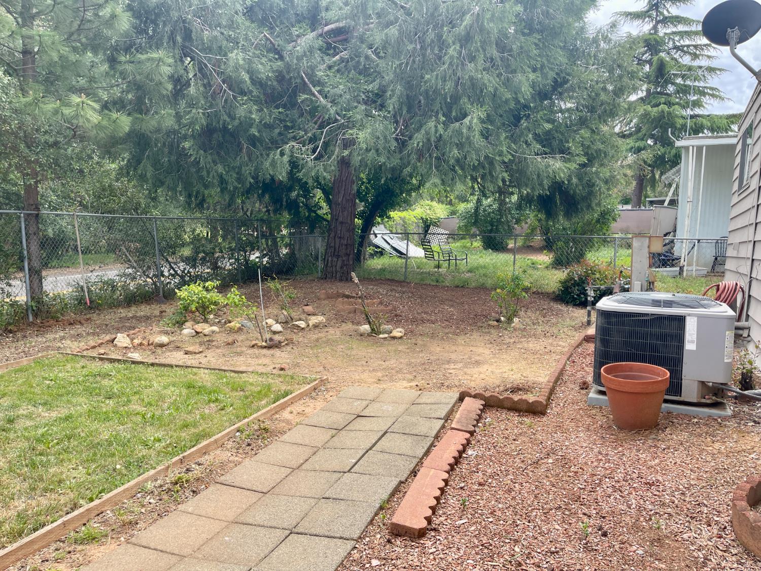 3550 China Garden Road, Unit 138 Placerville, CA 95667 - Photo 25 of 28 a backyard of a house with seating space