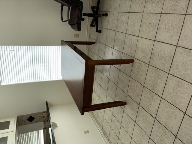 404 West 24th Street Bryan, TX 77803 - Photo 7 of 22 a workspace with furniture and window