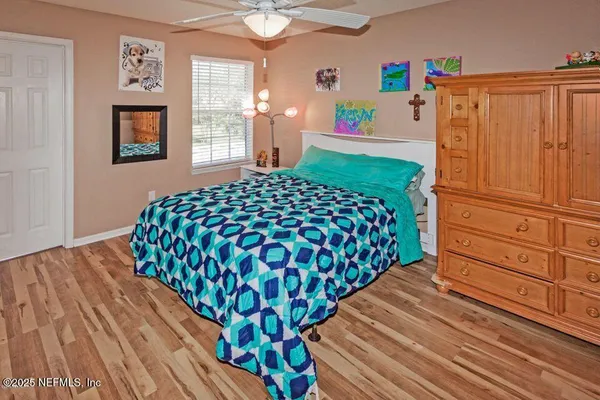 a bedroom with a bed and window