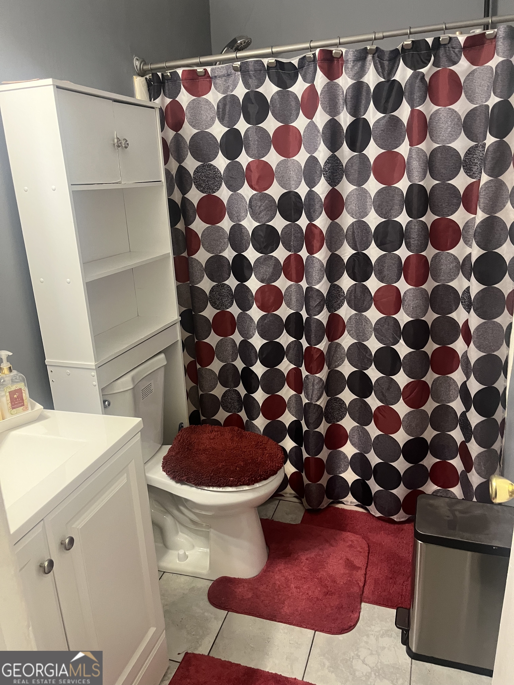 7013 Fielder Road Rex, GA 30273 - Photo 5 of 8 a bathroom with a sink and a toilet