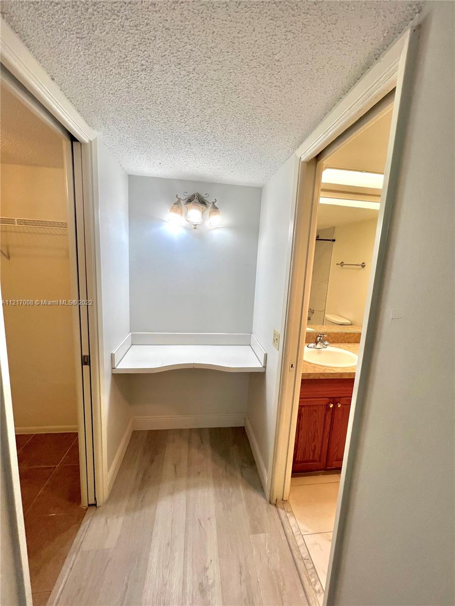3150 North Course Lane, Unit 107 Pompano Beach, FL 33069 - Photo 17 of 24 a bathroom with a bathtub and a sink