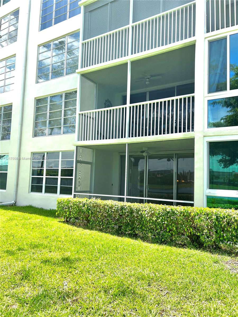 3150 North Course Lane, Unit 107 Pompano Beach, FL 33069 - Photo 20 of 24 a view of a backyard with a garden