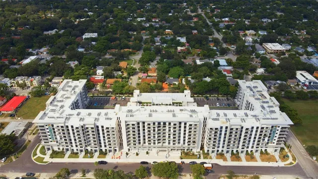 a view of a patio with table and chairs