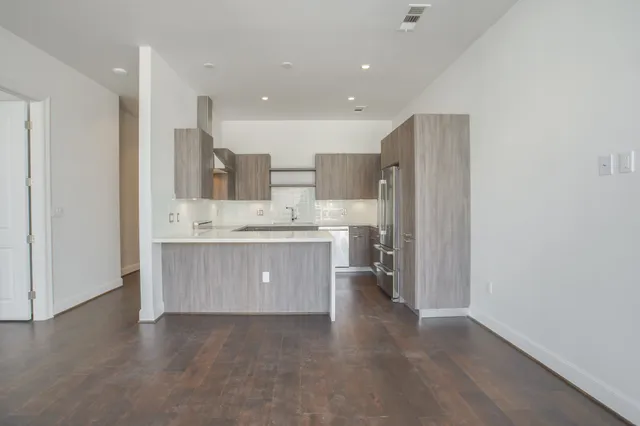 a view of kitchen with wooden floor