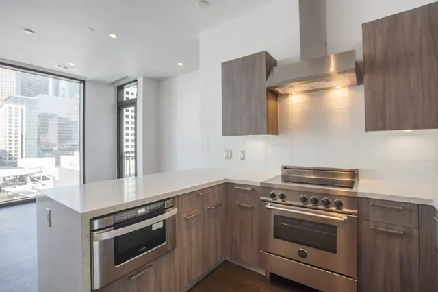 a kitchen with a stove and a sink