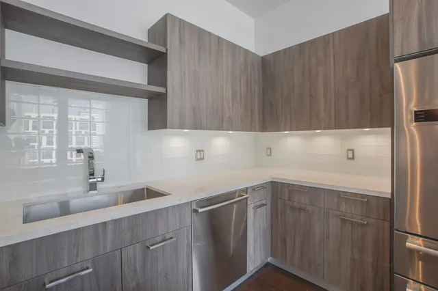 a kitchen with a sink and cabinets