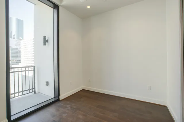 a view of a kitchen with a sink and a window