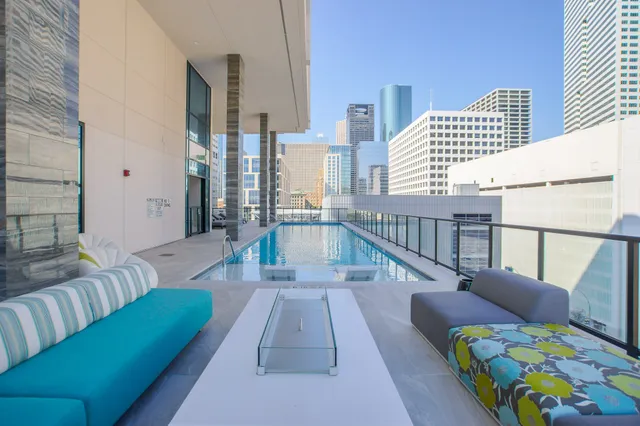 a balcony with furniture and rug