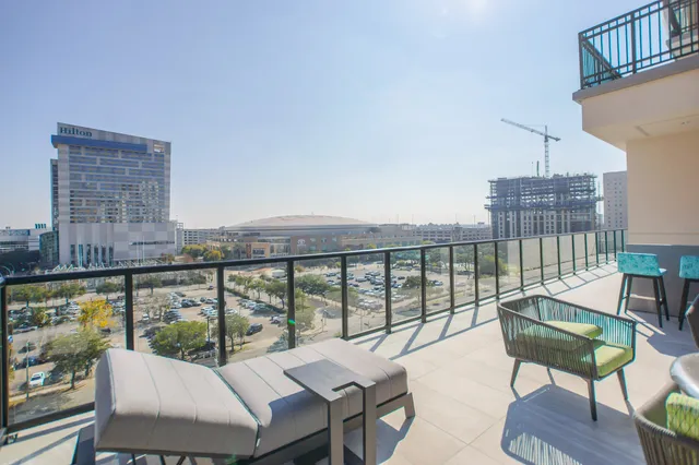 a view of a balcony with chairs