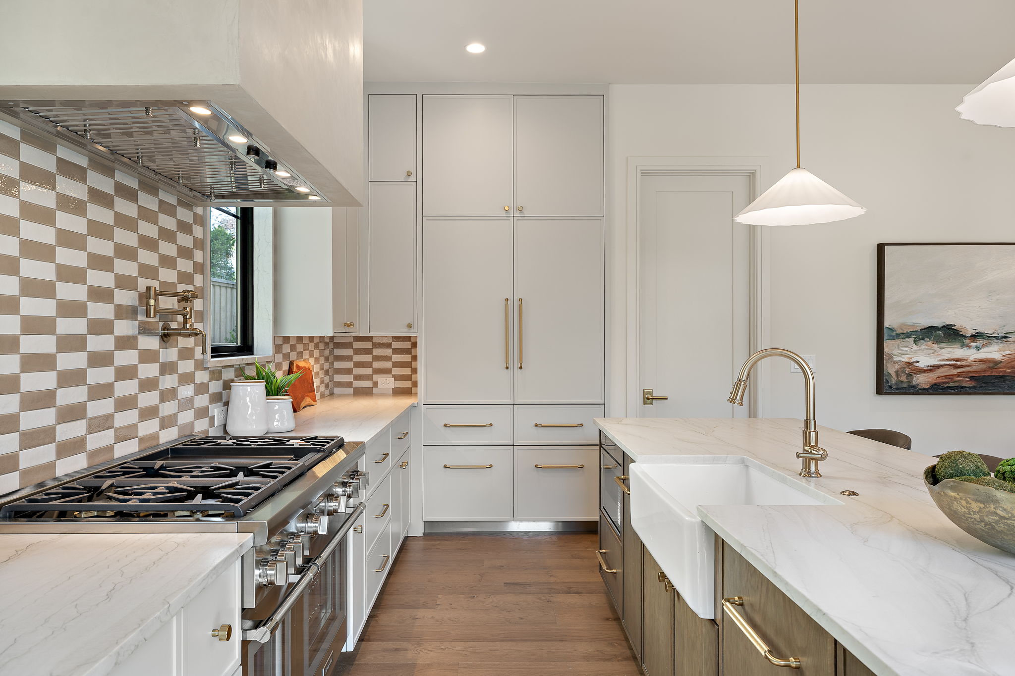 2705 Warren Street Austin, TX 78703 - Photo 14 of 39 a kitchen with stainless steel appliances a sink a stove and a refrigerator