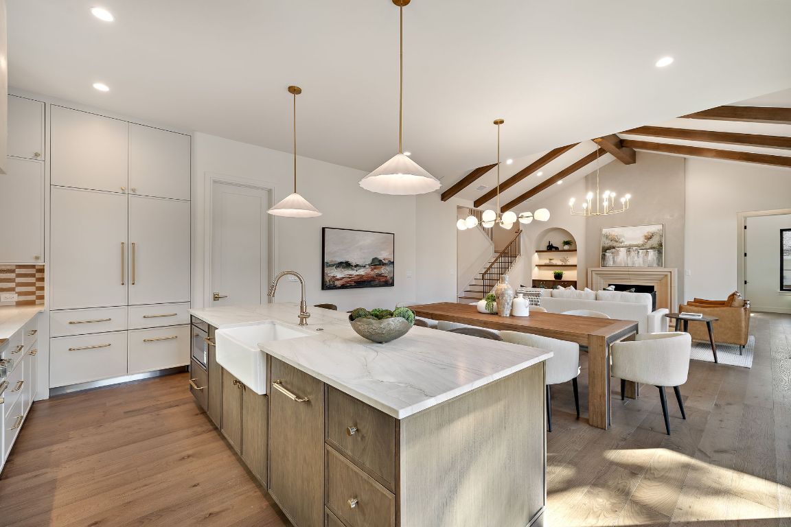 2705 Warren Street Austin, TX 78703 - Photo 15 of 39 a kitchen with stainless steel appliances granite countertop a sink a stove and a wooden floor
