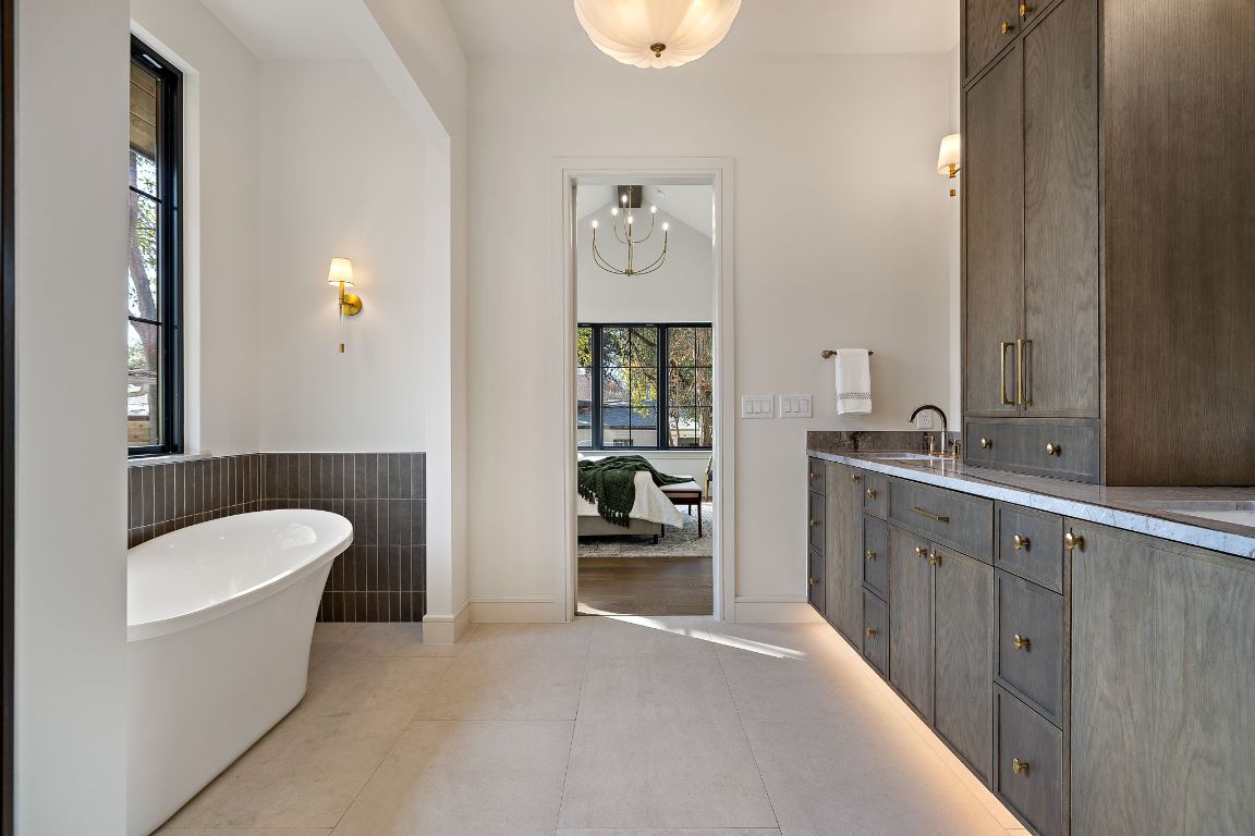 2705 Warren Street Austin, TX 78703 - Photo 22 of 39 a bathroom with a tub sink and mirror