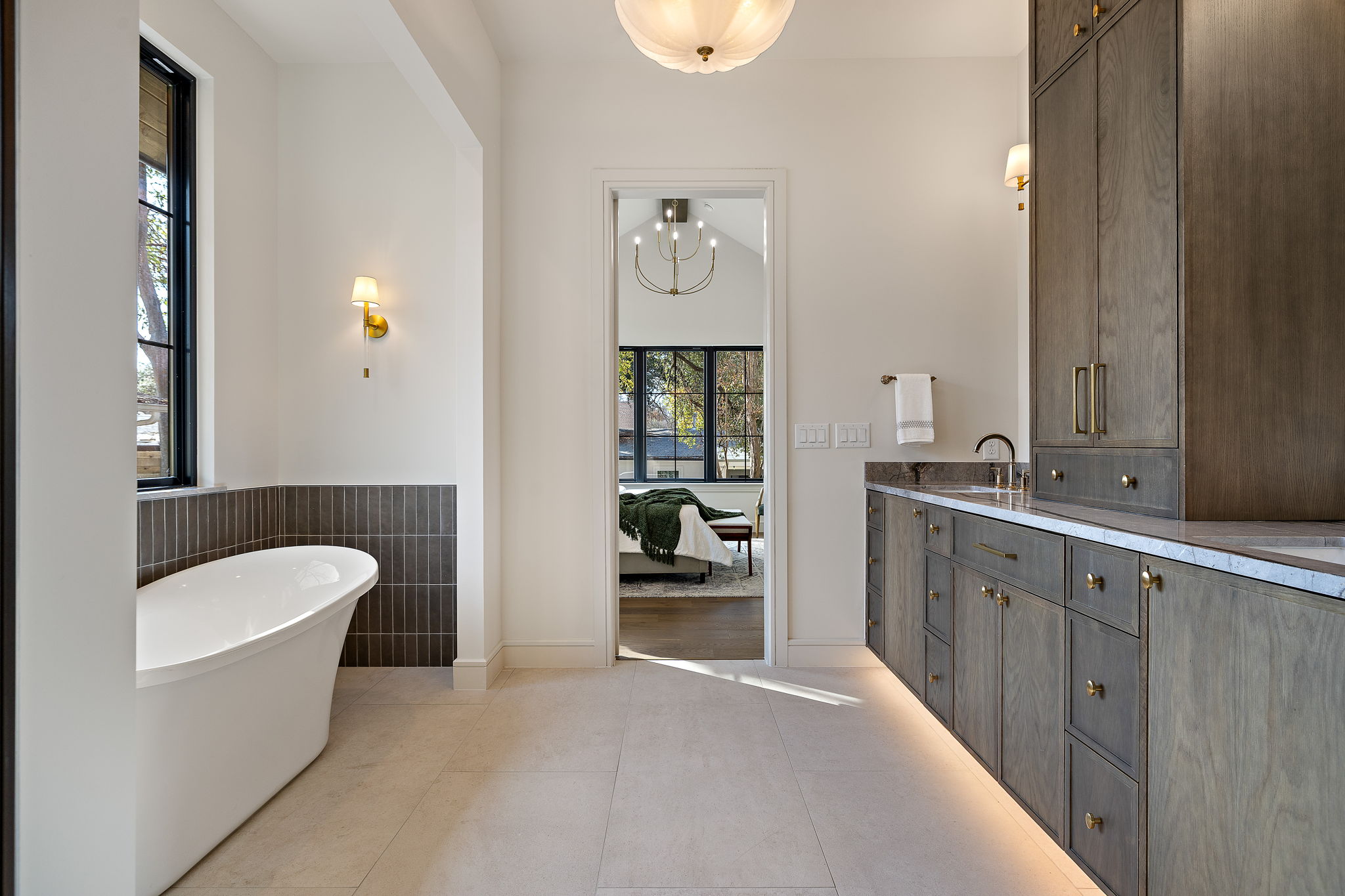 2705 Warren Street Austin, TX 78703 - Photo 22 of 39 a bathroom with a tub sink and mirror