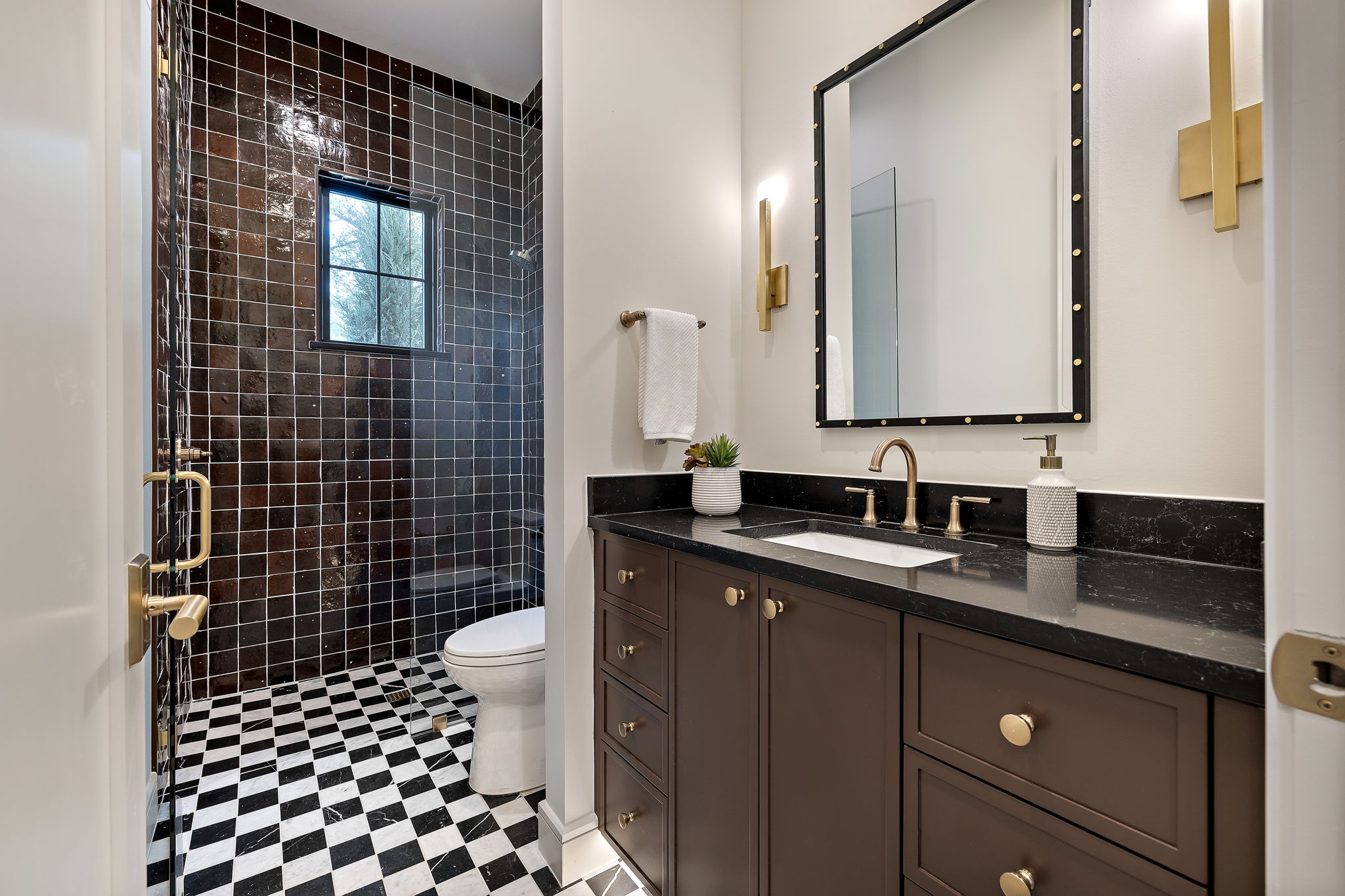 2705 Warren Street Austin, TX 78703 - Photo 23 of 39 a bathroom with a sink a toilet a mirror and shower