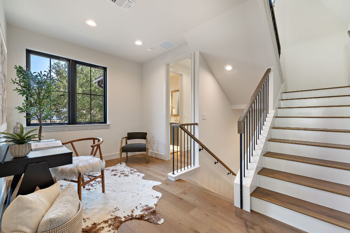 2705 Warren Street Austin, TX 78703 - Photo 25 of 39 a view of a livingroom with furniture wooden floor and windows