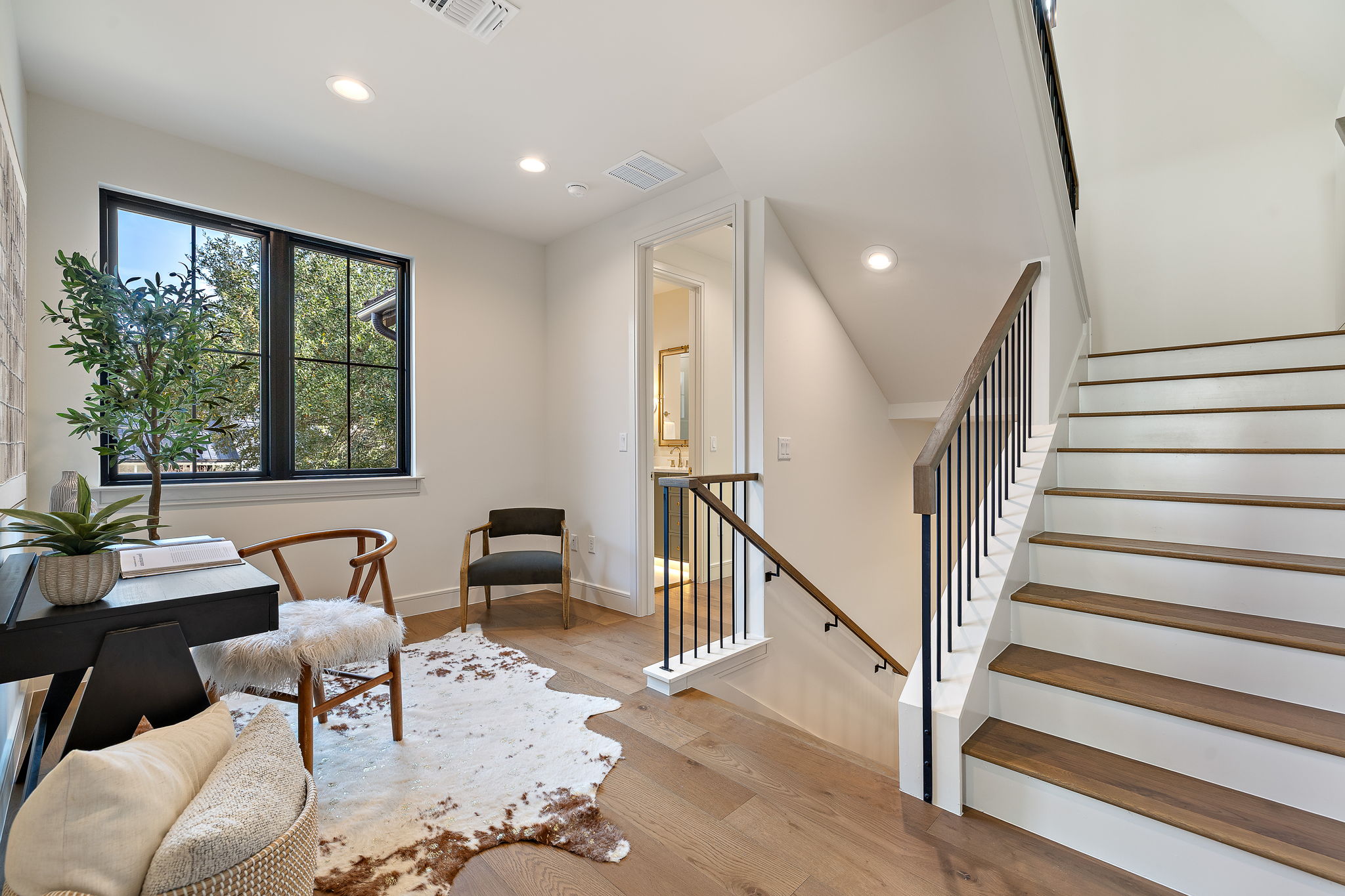 2705 Warren Street Austin, TX 78703 - Photo 25 of 39 a view of a livingroom with furniture wooden floor and windows