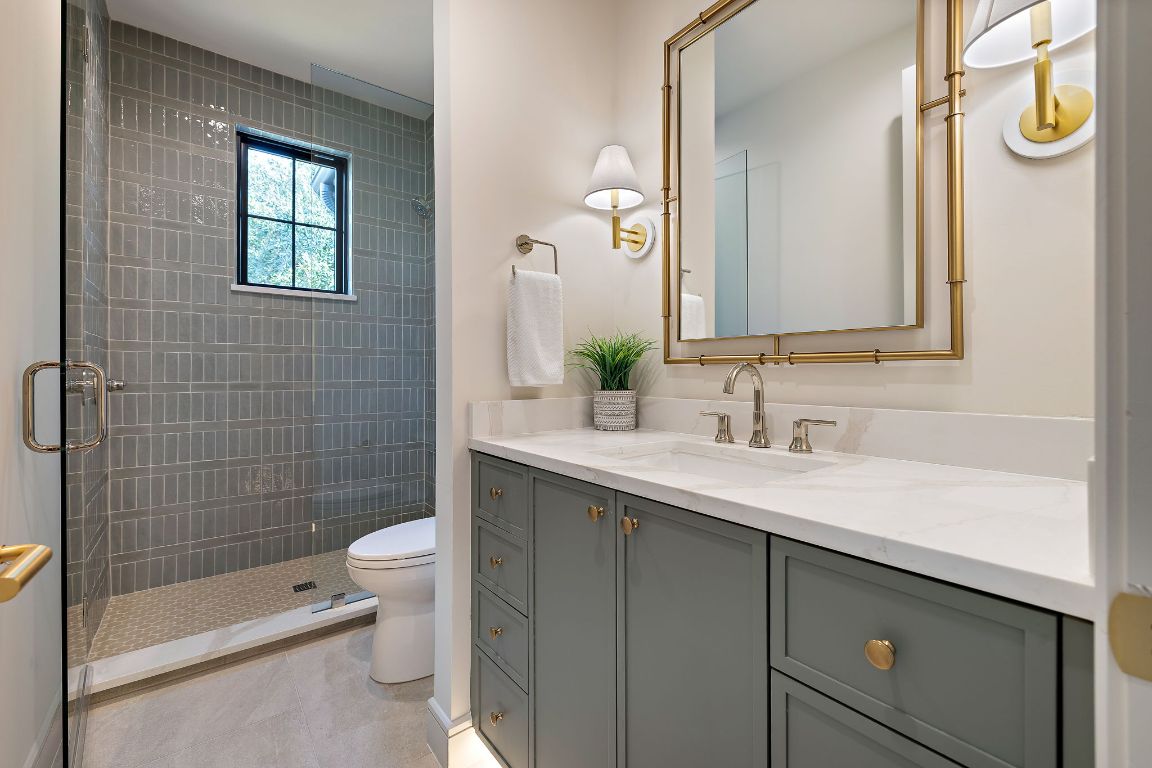 2705 Warren Street Austin, TX 78703 - Photo 27 of 39 a bathroom with a sink a toilet and shower