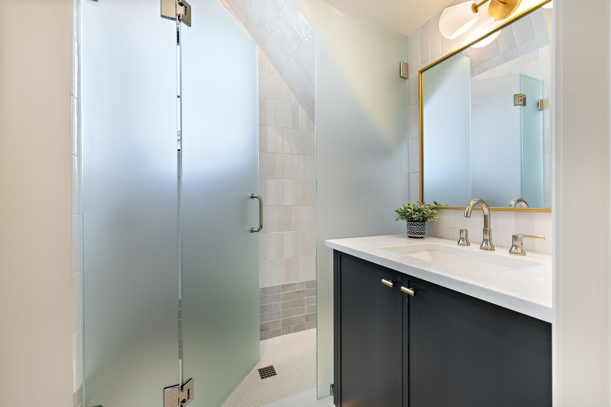 2705 Warren Street Austin, TX 78703 - Photo 29 of 39 a bathroom with a sink and a mirror