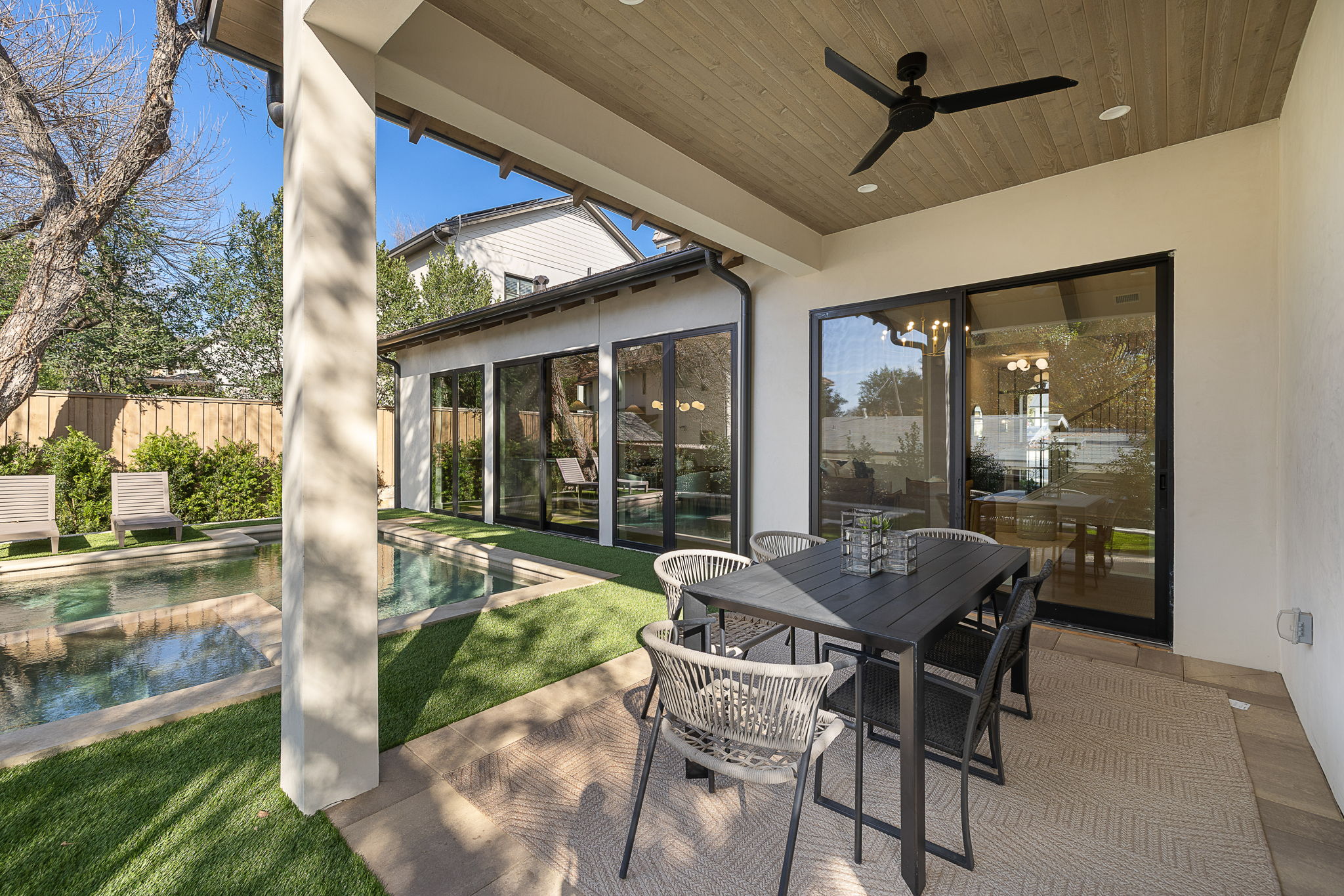 2705 Warren Street Austin, TX 78703 - Photo 36 of 39 a patio with yard glass top table and chairs