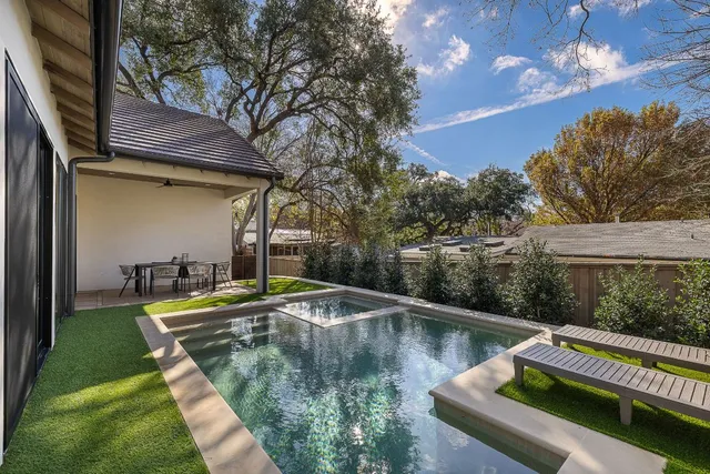 a view of pool with yard