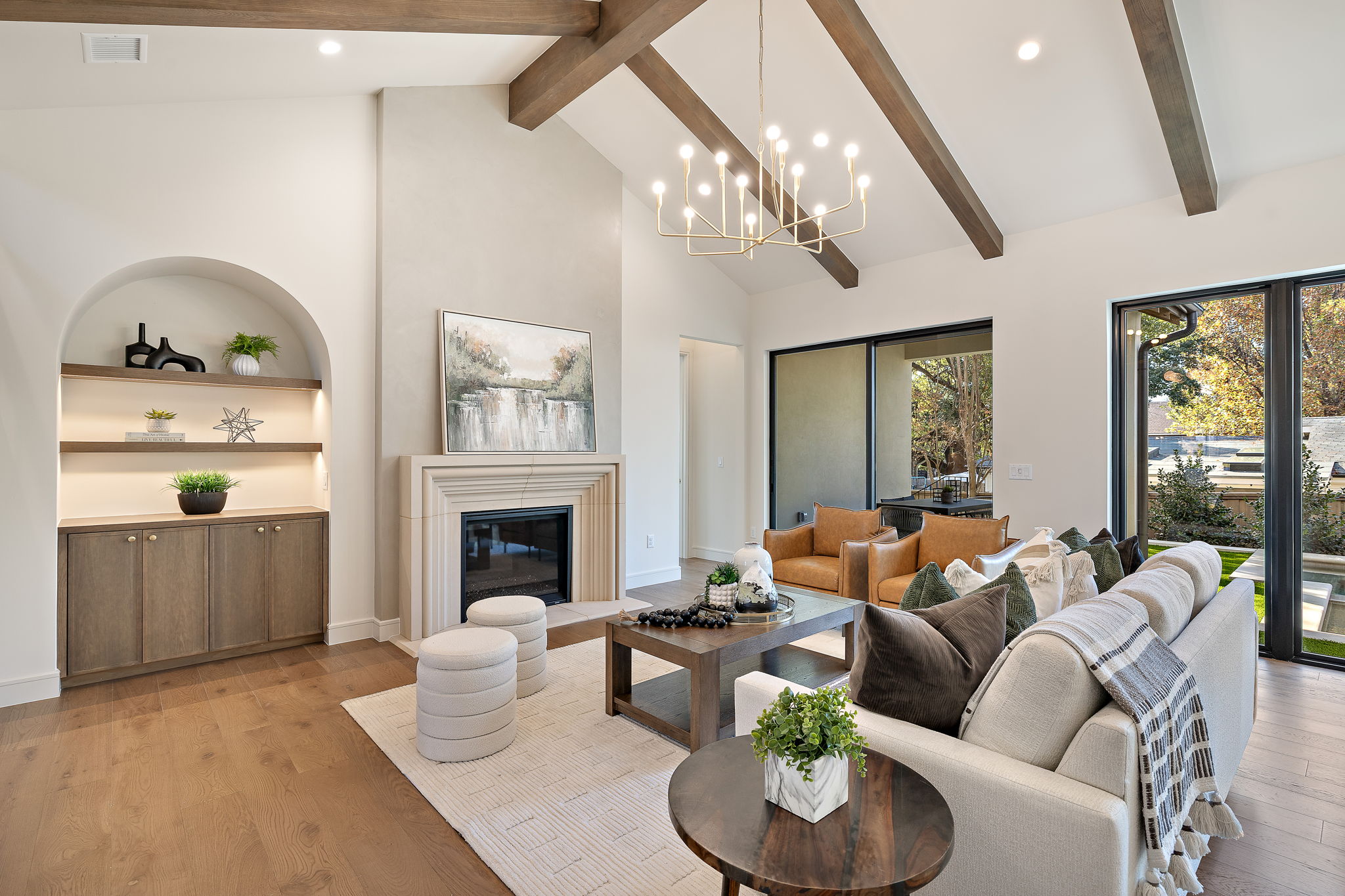 2705 Warren Street Austin, TX 78703 - Photo 5 of 39 a living room with furniture a chandelier and a fireplace