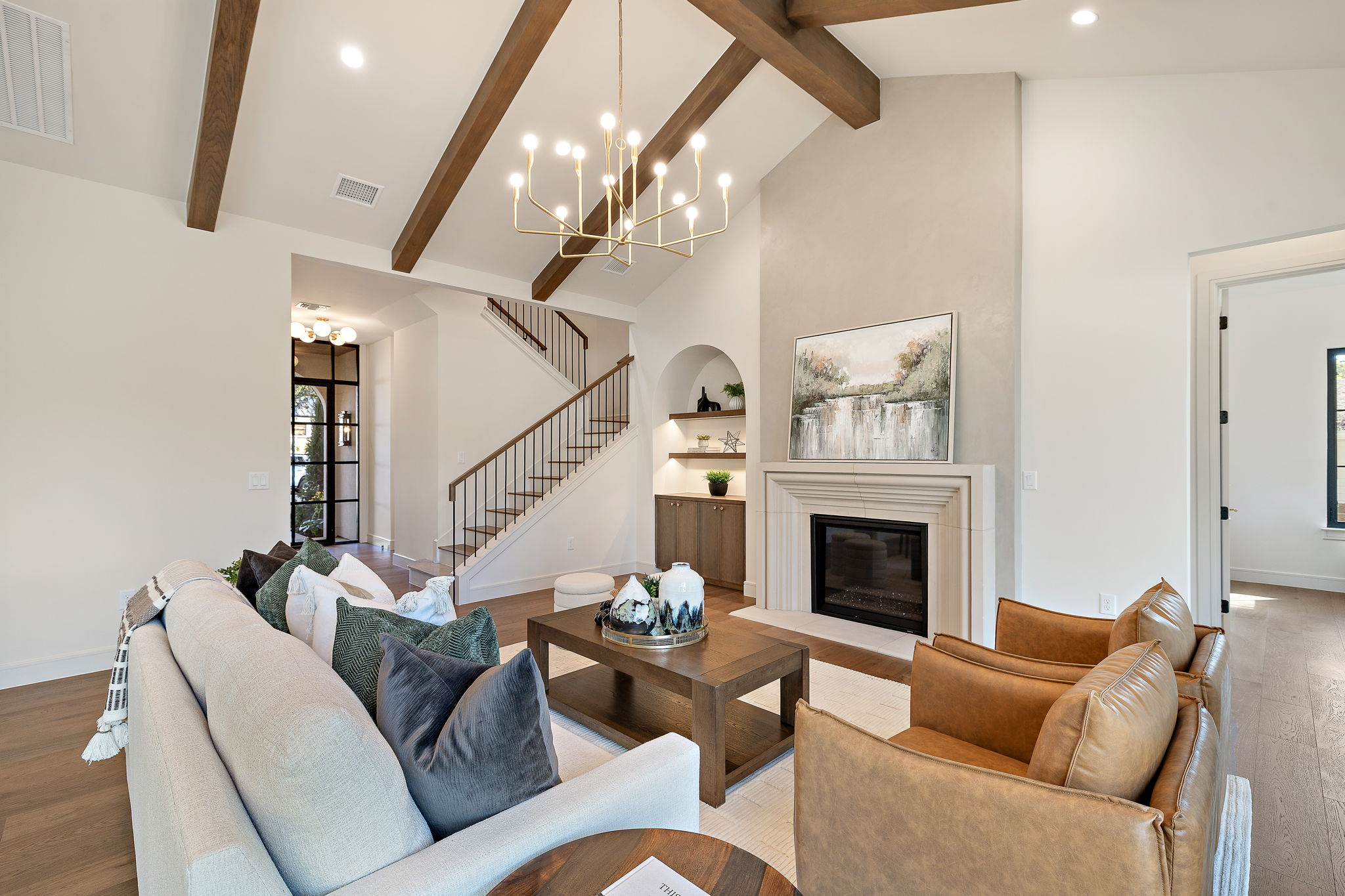2705 Warren Street Austin, TX 78703 - Photo 6 of 39 a living room with furniture a fireplace and a chandelier