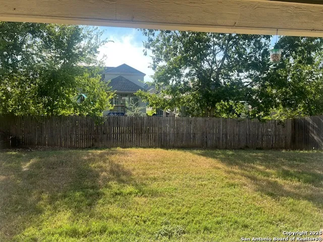 a kitchen with stainless steel appliances granite countertop a sink and a refrigerator