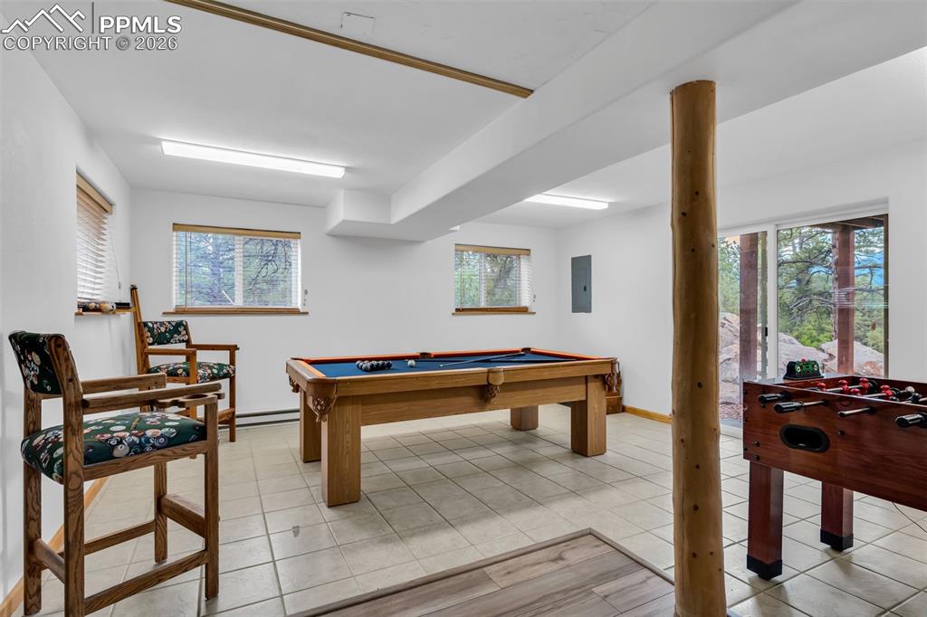 209 Rosewood Road Westcliffe, CO 81252 - Photo 36 of 49 Separate game room with walkout to backyard and mountain views