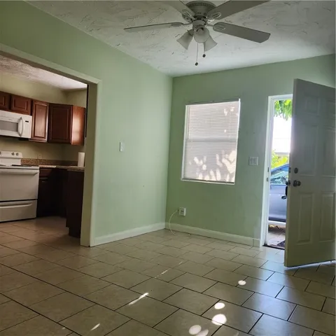a view of a kitchen with fridge and dishwasher windows
