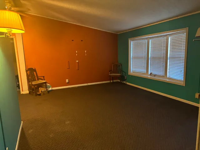 a view of an empty room with a window