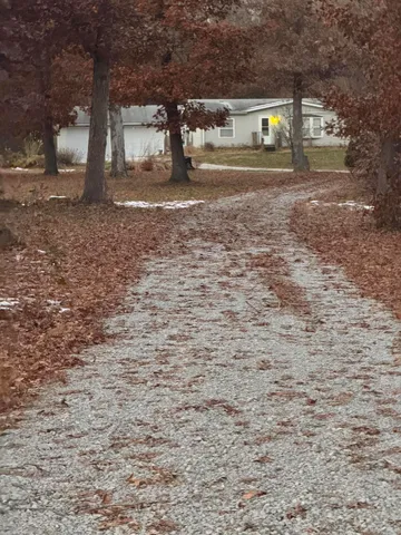 a view of a house and a yard