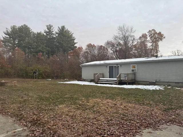 a view of a house with backyard space