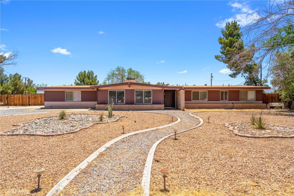 14253 Flathead Road Apple Valley, CA 92307 - Photo 1 of 1 a front view of a house with a yard