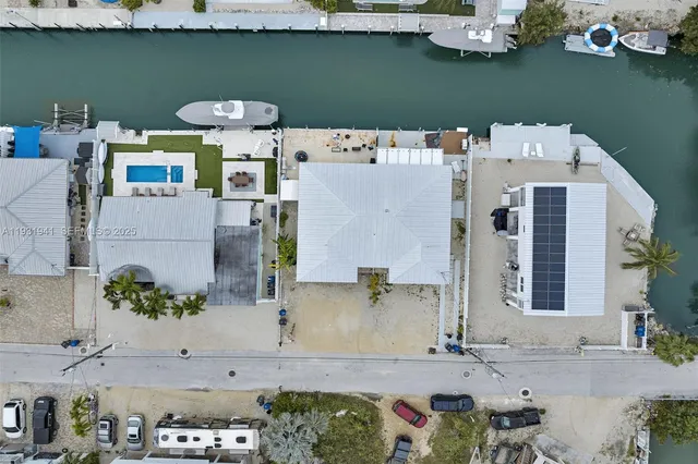 a aerial view of a house with outdoor seating