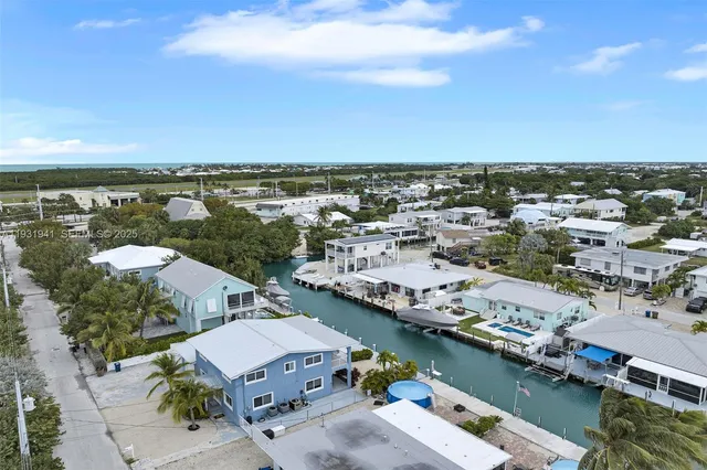 front view of a house with potted plants