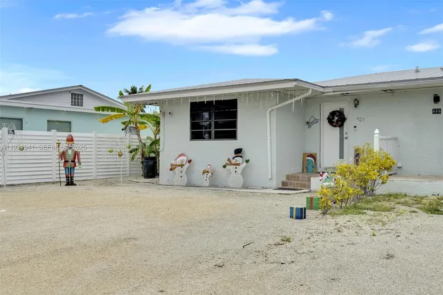 a view of multiple houses with a street