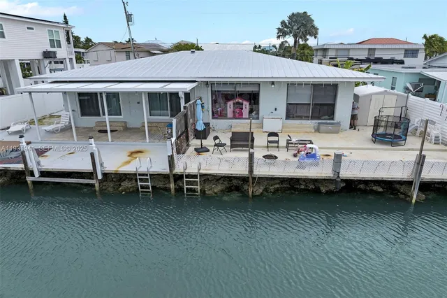 a view of a patio with table and chairs