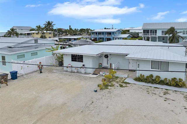 a aerial view of a house with a swimming pool