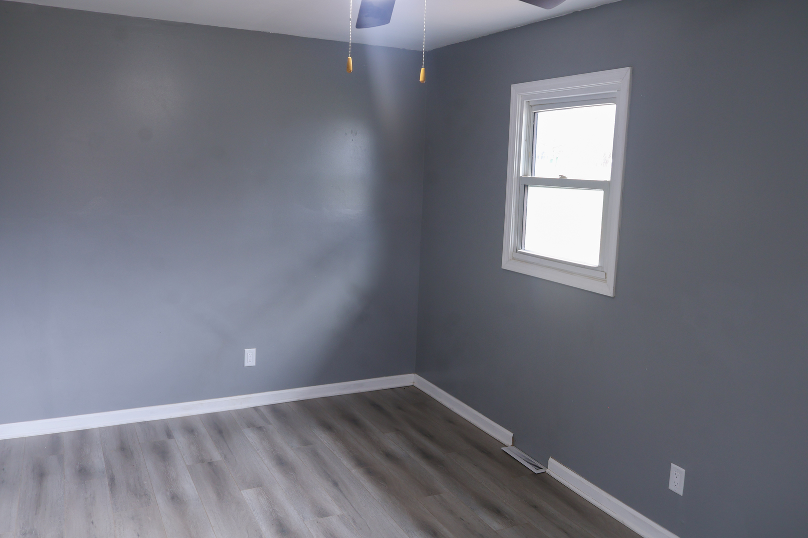 8403 Grange Hall Road Garden Prairie, IL 61038 - Photo 13 of 26 an empty room with wooden floor and windows