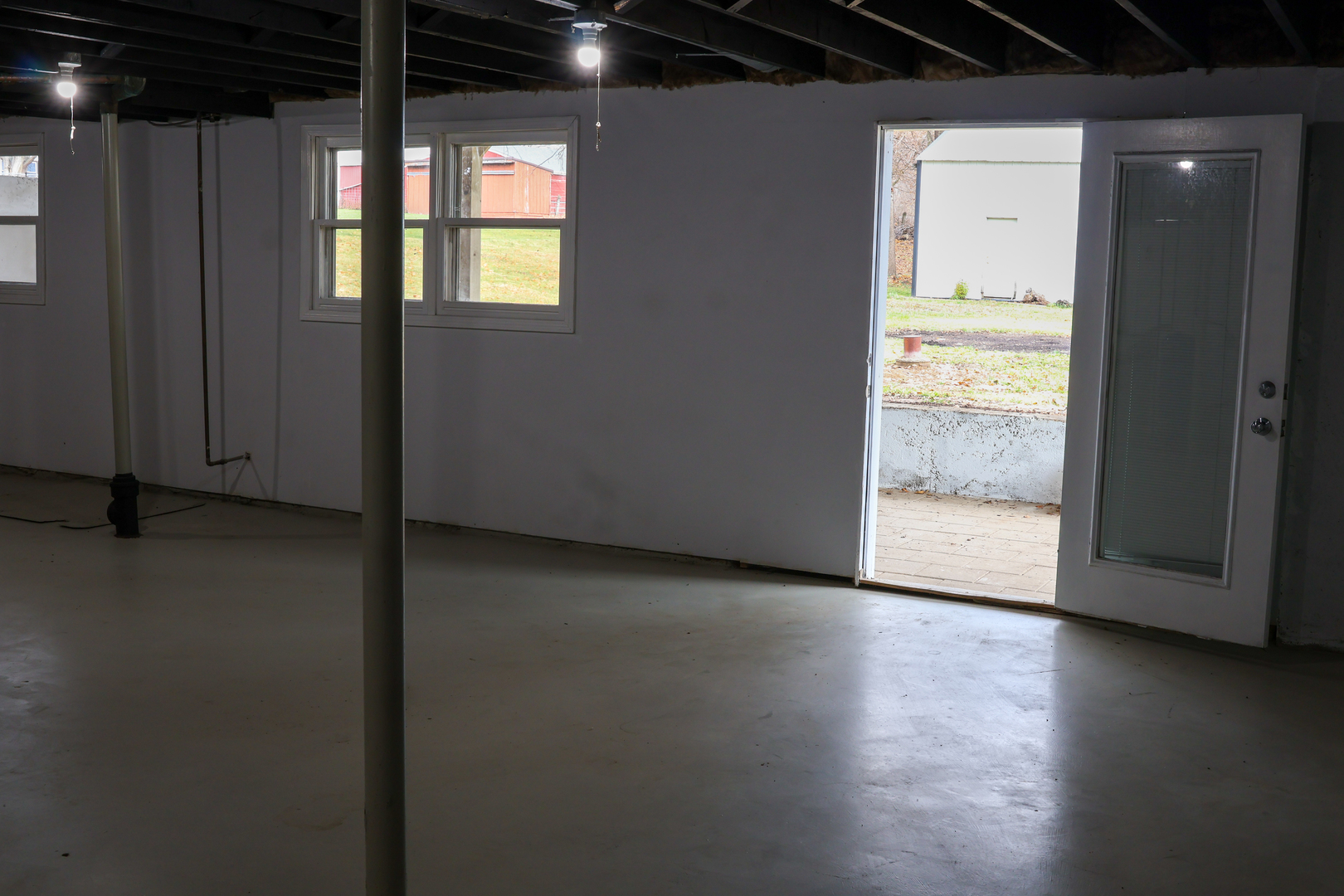 8403 Grange Hall Road Garden Prairie, IL 61038 - Photo 17 of 26 a view of an empty room with wooden floor and a window
