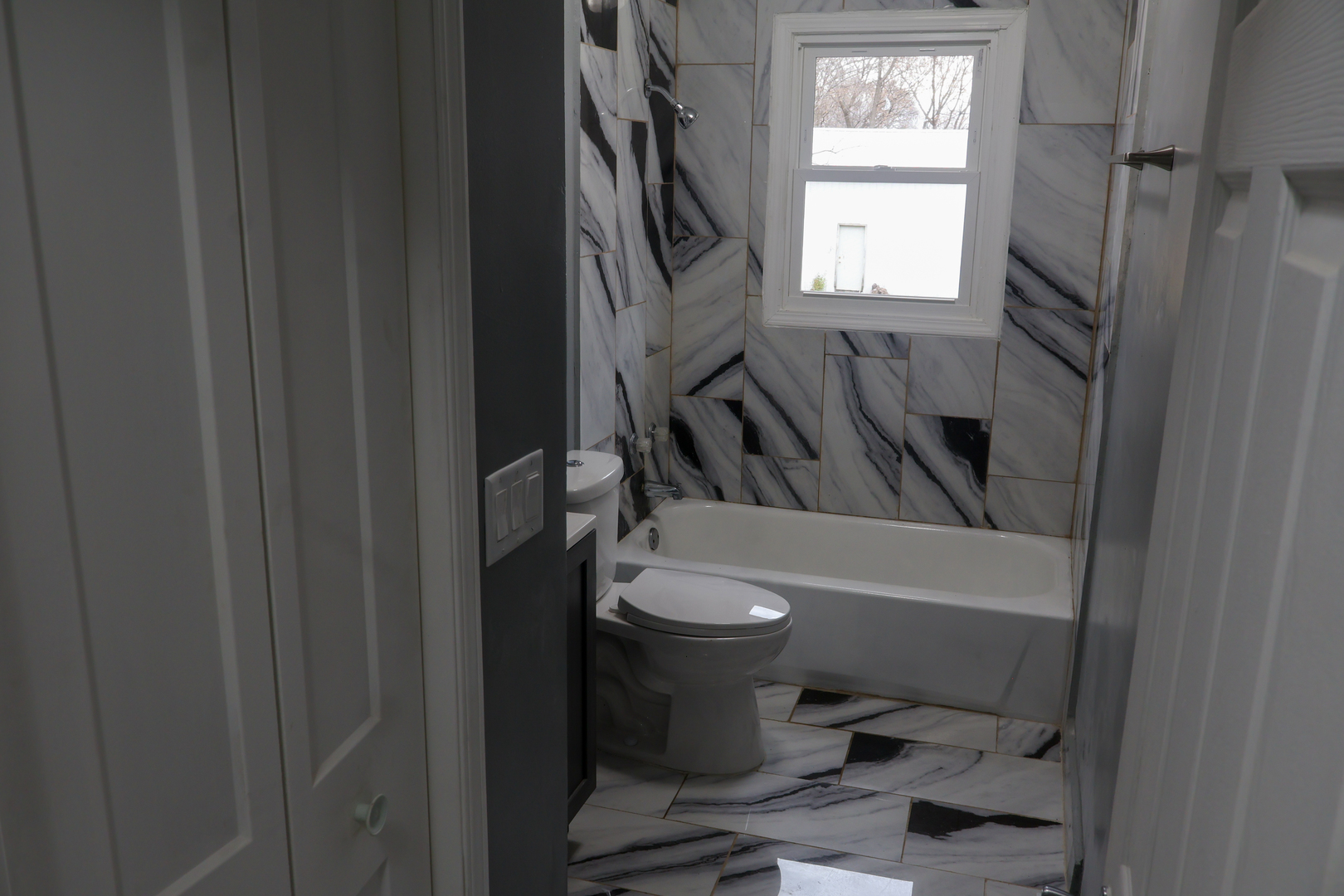 8403 Grange Hall Road Garden Prairie, IL 61038 - Photo 5 of 26 a bathroom with a sink toilet and shower